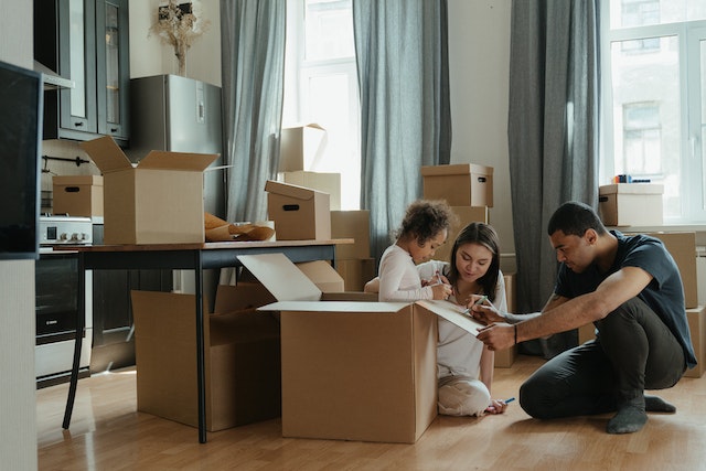 family with moving boxes